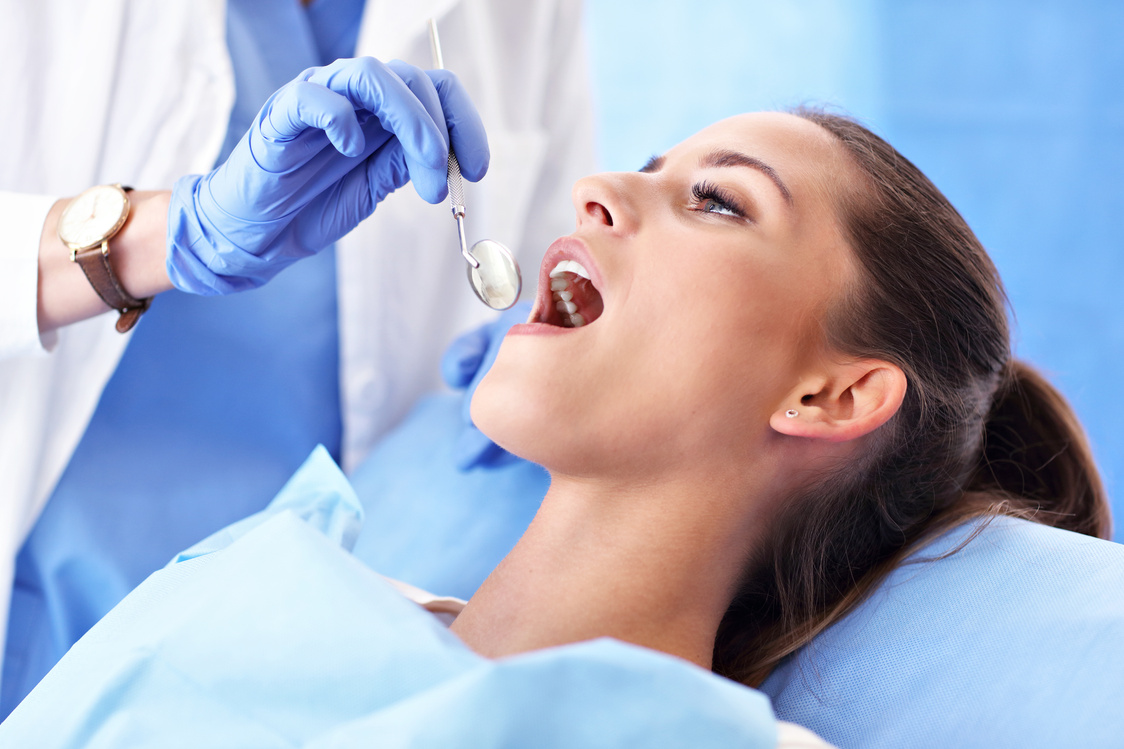 Adult Woman Having a Visit at the Dentist's